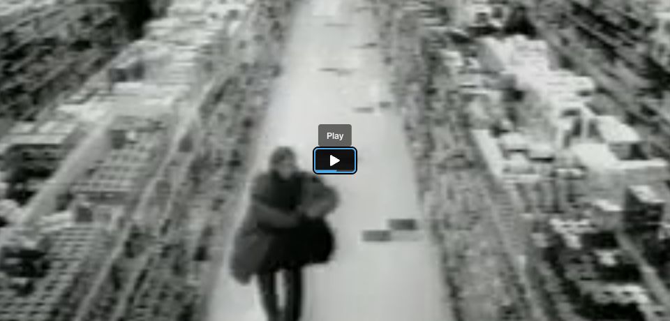 A shopper in a supermarket aisle, from the IBM RFID checkout commercial